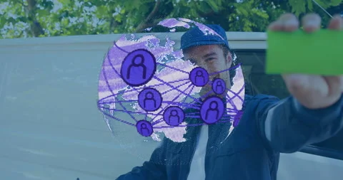 Delivery worker signing form by van, then showing green card as purple globe Stock Footage 314743582