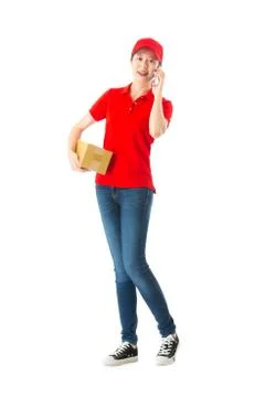 Delivery worker standing in white background 库存照片