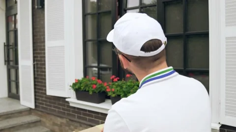 Deliveryman dcarrying parcel and folder. Stock Footage 158924403
