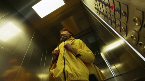 The deliveryman in the elevator Stock Footage 236900168