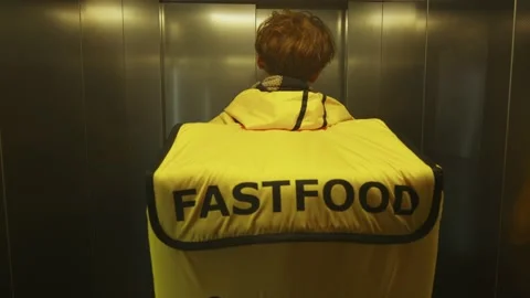 The deliveryman gets out of the elevator Stock Footage 236899513