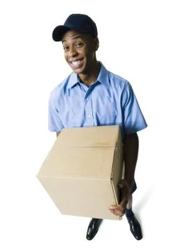 Deliveryman holding a parcel Stock Photos