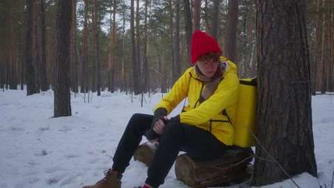 The deliveryman leaned against a tree Stock Footage 236900444
