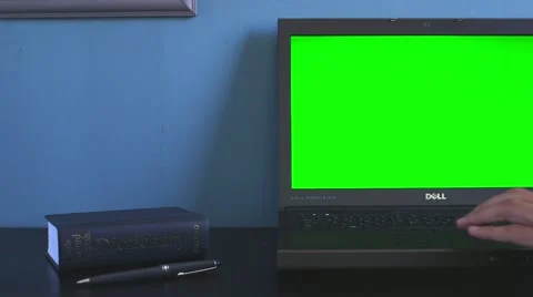 Dell computer on desk showing users hand Видео 63982269