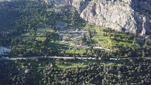Delphi Greece, Wide Drone Zoom Out of Entire Site and Mountains at Sunset 2K Stock Footage 157998330