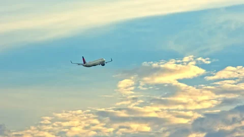 Delta Airbus A321 Taking Off Flying into a Vibrant Sky with Sunset Clouds Stock Footage 148529283