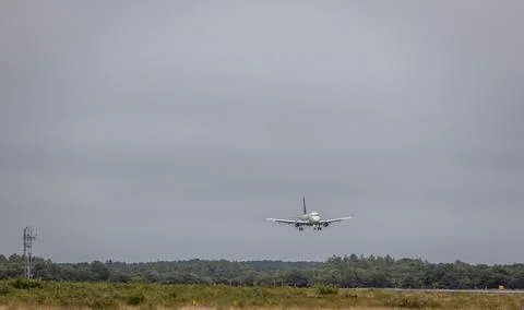 Delta Airlines plane landing at Martha's vineyard airport on a cloudy day Stock Photos