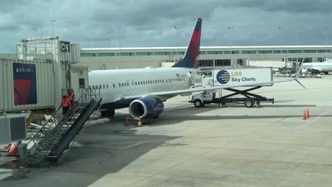 Delta airplane being loaded at the gate. Video stock 247294106