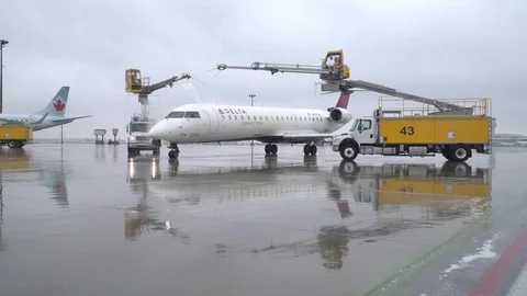 Delta CRJ being Deiced Stock Footage 91508466