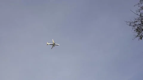 Delta plane flying slowly in the sky. Airplane in flight departing Stock Footage 176102471