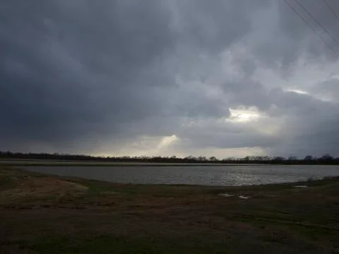Delta Sunset - clouds over the fish ponds Foto stock