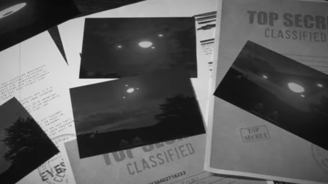 Delta Triangle Ufo Evidence files on a table Stock Footage 156364465
