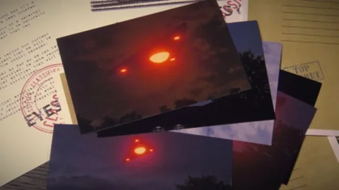 Delta Triangle UFO files on a table with photographs Stock Footage 156364657