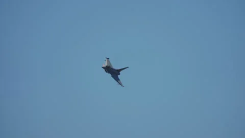 Delta wing fighter jet performing steep bank maneuver Stock Footage 336735346