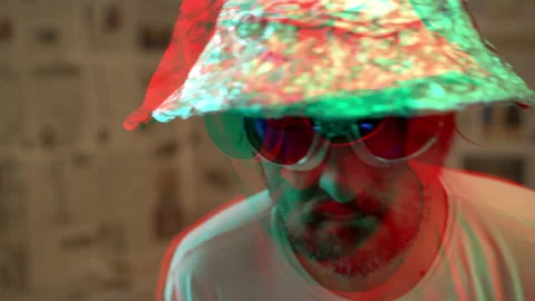 Delusional paranoid man with tin foil hat Video stock 130338341