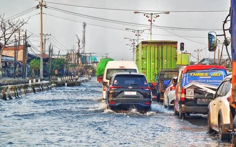 Demak, Indonesia on 27 Jun 2025. Banjir Sayung. Vehicles Navigating Flooded.. Фото