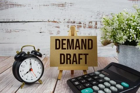 Demand Draft text with alarm clock and calculator on wooden background Stock Photos