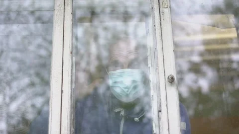 Demented aged man in face mask waving greeting gesture with hand Stock Footage 151208182