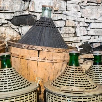Demijohns of wine. Stock Photos