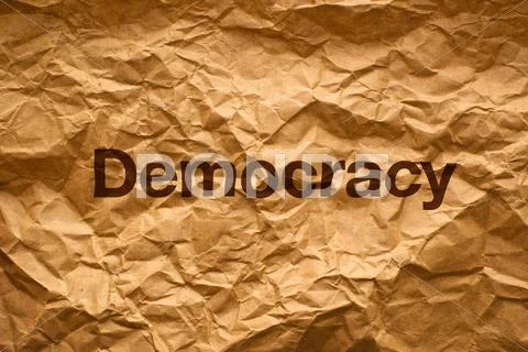 Democracy on crumpled paper Stock Photos