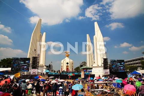 Democracy monument with anti-government protesters Stock Photos