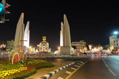 Democracy Monument located at the intersection of the streets of the night city. Stock Photos