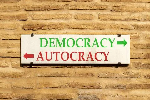 Democracy or autocracy words symbol. Concept words Democracy Autocracy on b.. Stock Photos