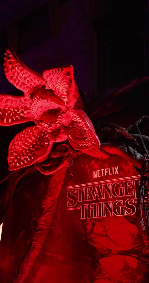 Demogorgon Creature Stranger Things Logo Illuminated in Red Stock Footage 324897118