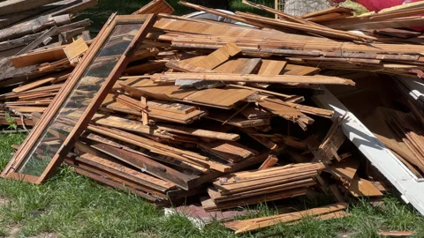 Demolished Wooden Window Frames and Wall Panels Piled Outdoors Awaiting Disposal Stockbeeldmateriaal 335597370