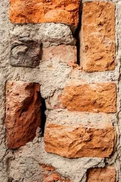 Demolition of a brick wall , construction backdrop , abstract textures close  Stock Photos