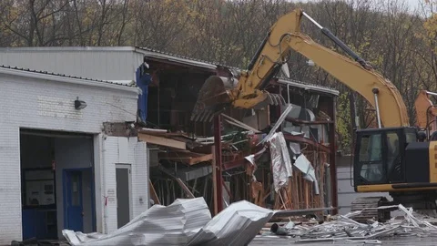 Demolition of a Building with Excavator Stock Footage 81739981