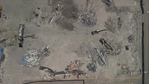 Demolition of the building. Excavator working rubbish in a demolition site. Top Stock Footage 287271053