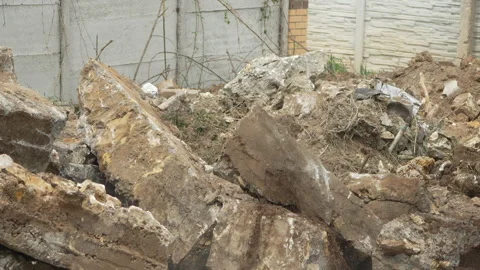 Demolition, construction, debris falling onto a concrete pile at a building site Vídeos de archivo 312985738