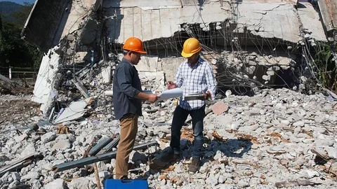 Demolition control supervisor and contractor working on demolish building. Stock Footage 113102472