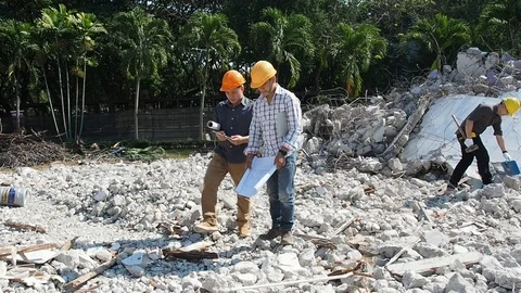 Demolition control supervisor and foreman discussing on demolish building. Stock Footage 102226265