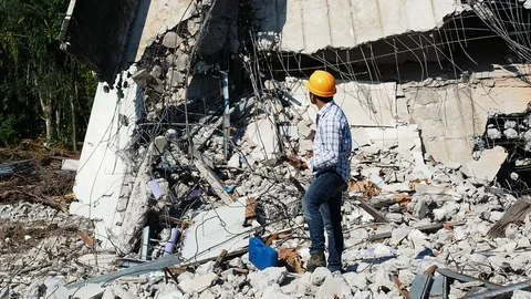 Demolition control supervisor or engineer on demolish building. Stock Footage 107427877