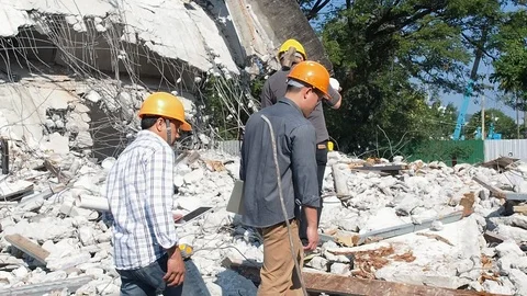 Demolition control supervisor teams ,contractor, foreman and engineer walking Stock Footage 111069489