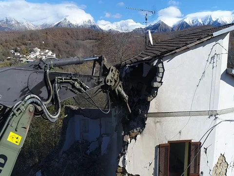 Demolition cutters tearing down  a wall. Aerial shot Stock Footage 112662463