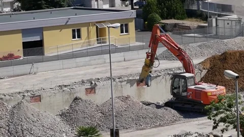 Demolition grapple while removing iron Stock Footage 137699604