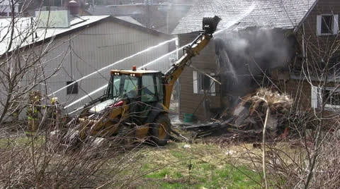 Demolition of a House on Fire Stock Footage 26651187