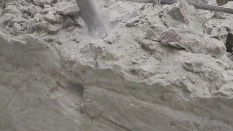 Demolition of a jackhammer of a concrete structure at a construction site close Stock Footage