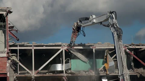 Demolition machine is breaking building Stock Footage 236274296