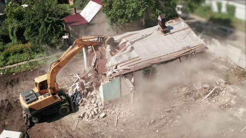 Demolition of old house building process for new construction by excavator Stock Footage 159793257