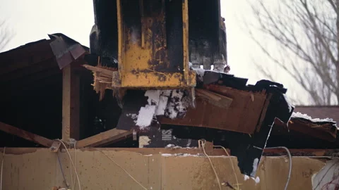 Demolition process of a building with heavy machinery in action Stock Footage 310180585