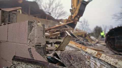 Demolition project in progress at old building site with heavy machinery Stock Footage 310176717