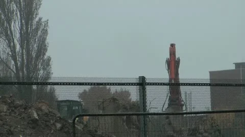 Demolition workers move rubble from old tower block Stock Footage 14773193