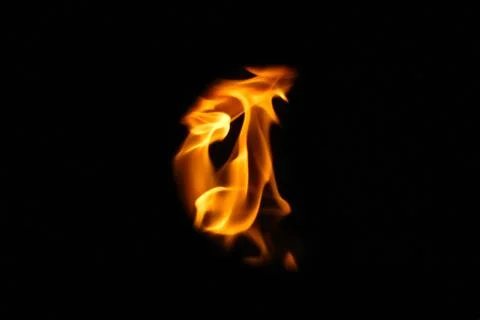 Demon fire flames. Eagle silhouette Fire embers particles over black backgr.. Stock Photos