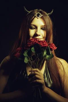 Demon with flowers Stock Photos