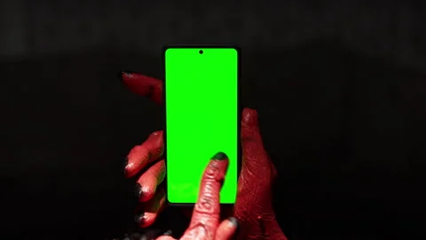 Demon Hands Using Smartphone with Green Screen Stock Footage 318982787