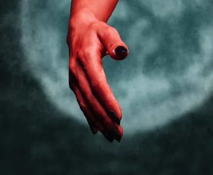 Demon handshake on background of moon Stock Photos